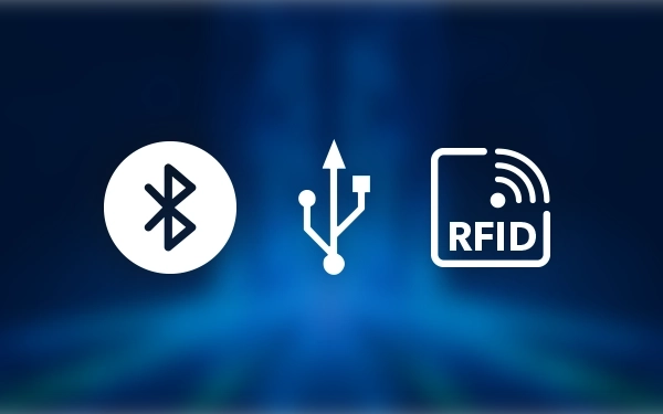 Ikony Bluetooth, USB (Universal Serial Bus) i RFID (Radio Frequency Identification) na ciemnym, niebieskim tle