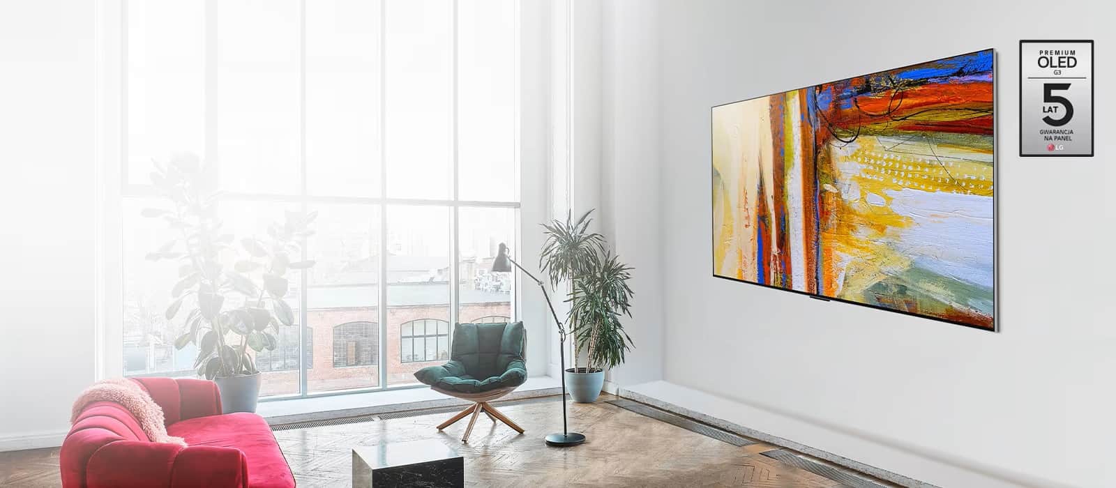 Фото телевізора LG OLED G3, на якому зображено барвистий абстрактний витвір мистецтва у світлій кімнаті.