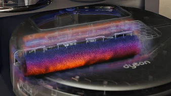 Поперечний розріз робота, на якому виділено ролик під час прибирання. Ролик злегка червоний, що символізує теплу воду.