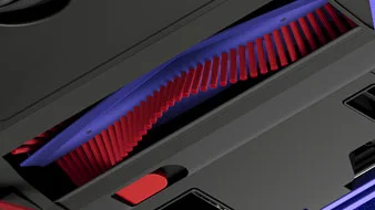 Крупний план синьо-червоної щітки для волосся та хутра, вбудованої в пристрій.