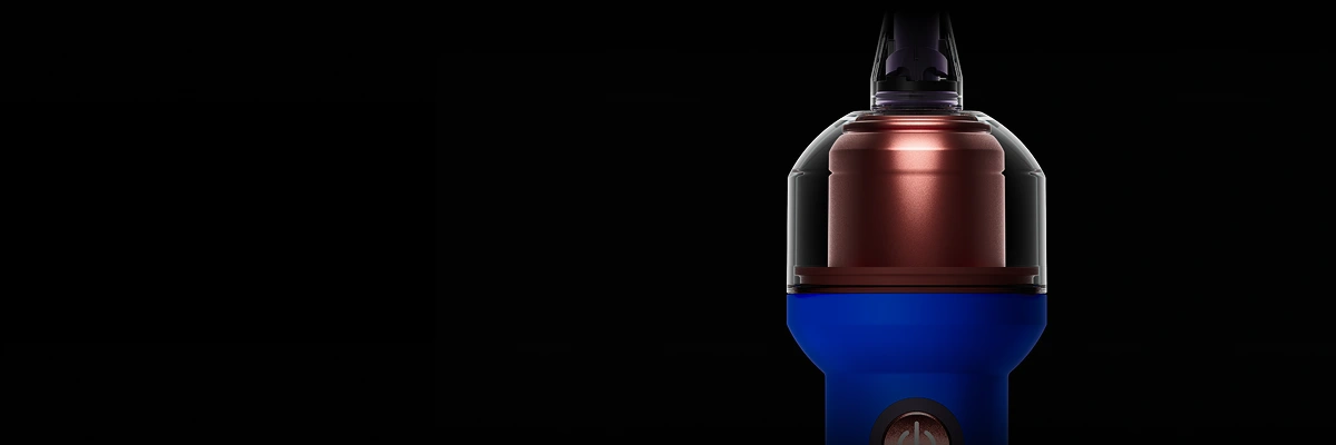Крупний план круглого резервуара на синій щітці Dyson CameraJet