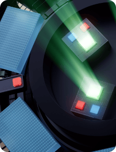 Розташування електронних компонентів, два з яких – у центрі – випромінюють зелене світіння