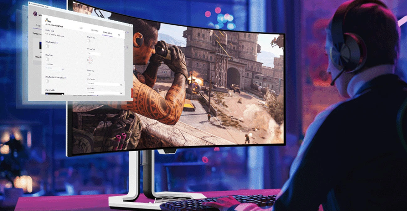 Монітор Lenovo Legion Pro 34WD-10 на столі, перед яким сидить молода людина та грає в комп'ютерну гру.