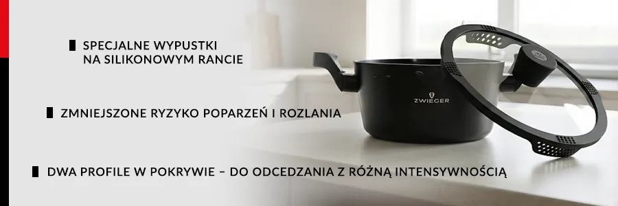 Garnek Korra ZWIEGER i pokrywka która jest oparat o garnek pod kątem 45 stopni, wszystko na marmurowym blacie, widoczne są otowory do odcedzania wystajace z pokrywki garnka