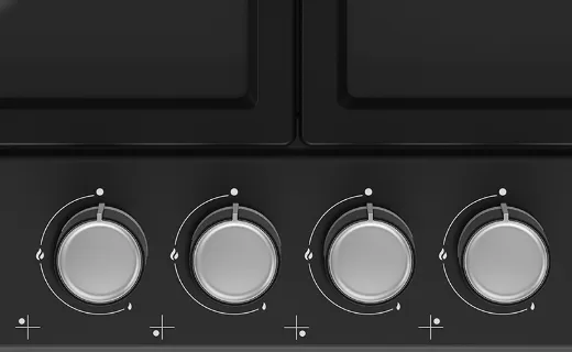 Крупний план ручок газової варильної поверхні; темний варіант