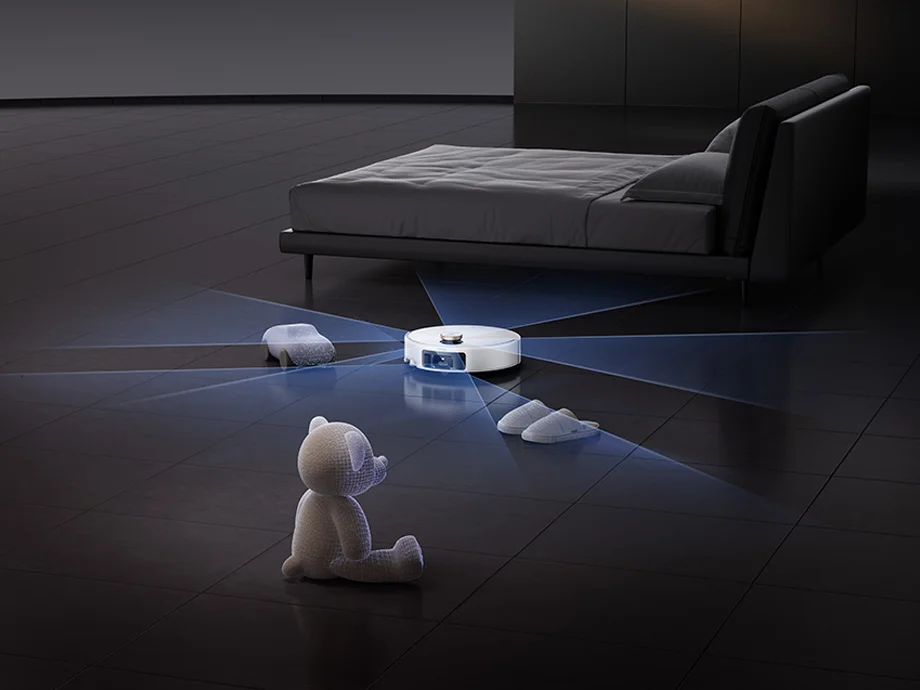 Робот очищає підлогу, уникаючи перешкод на ній.