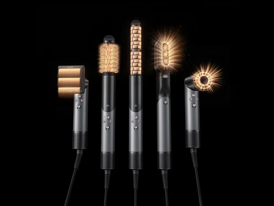 П'ять інструментів для укладання волосся з різними підсвіченими кінчиками на чорному фоні