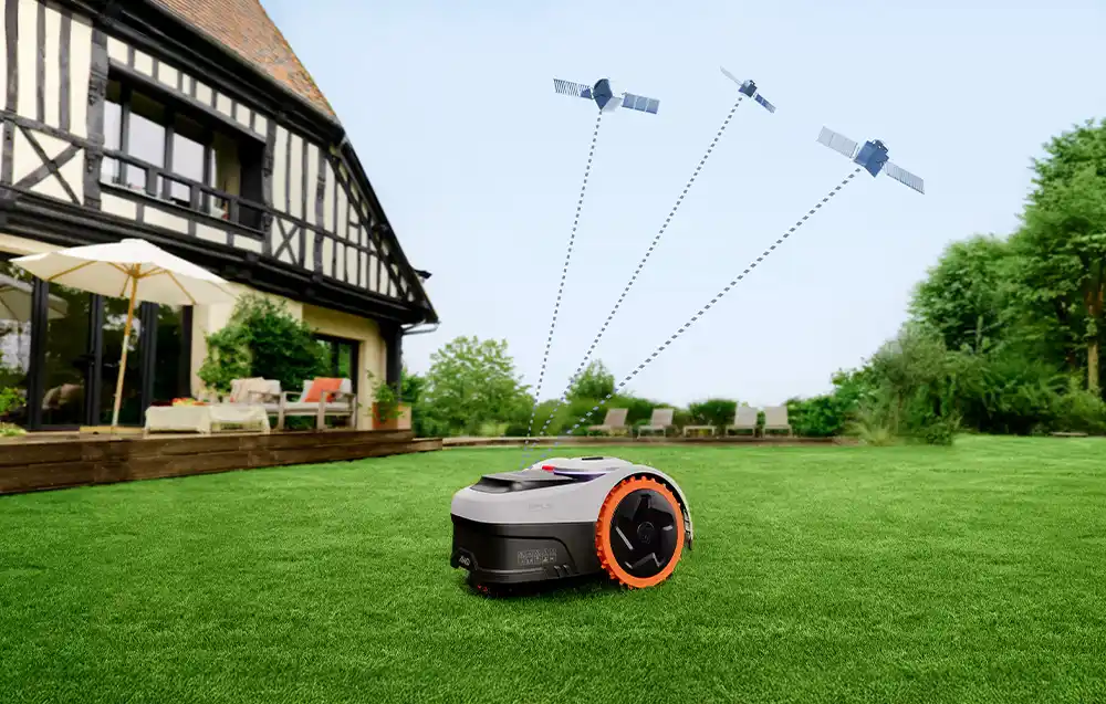 робот, що косить газон перед будинком, підключений до супутників у небі