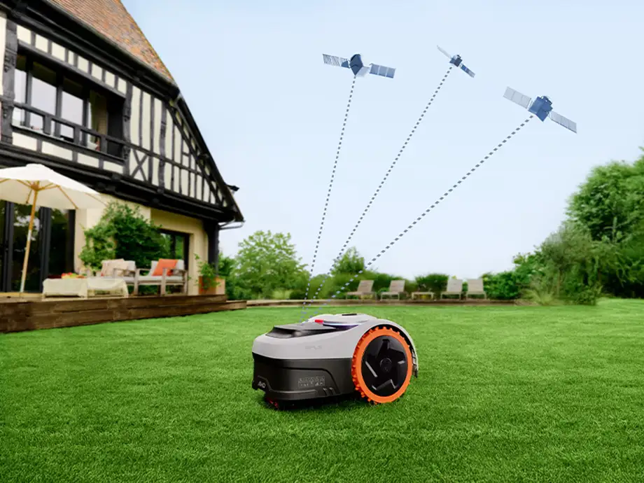 робот, що косить газон перед будинком, підключений до супутників у небі